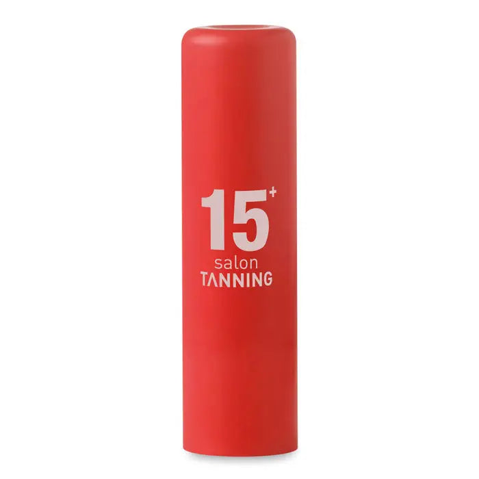 Balsam de buze cu factor de protectie 15 plus recipient cilindric rosu pentru bronzare in salon