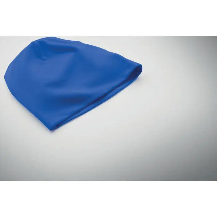 Un beanie unisex din bumbac cu o căciulă de înot albastru regal vibrant din silicon moale și flexibil cu design fix