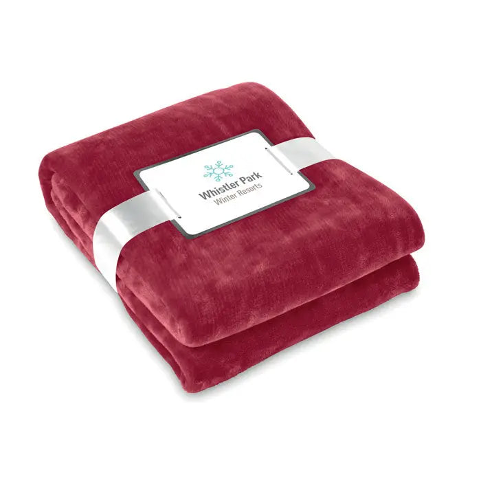 Flanel pătură roșie adâncă cu textură catifelată velour și etichetă albă whistler park winter resorts