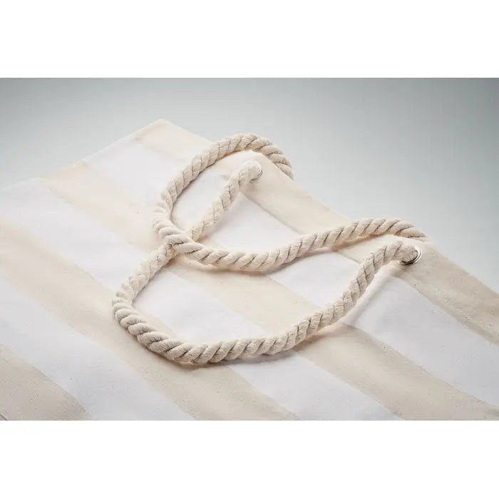 Cream-colored rope handles with twisted texture on striped cotton beach tote bag 220 gr/m²
