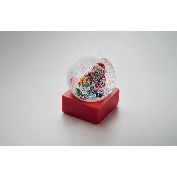 Ornament de sticla cu bile de zapada cu baza rosie din plastic si mos craciun miniatural in glob transparent