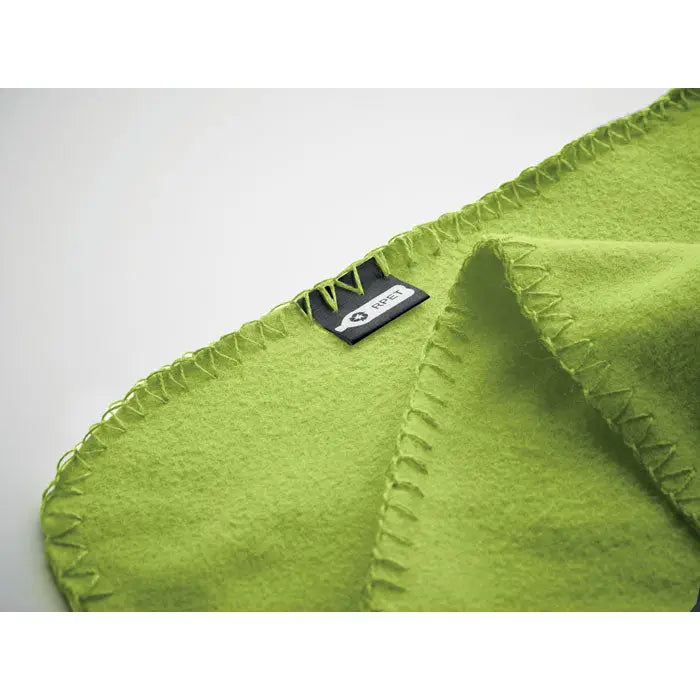 Pătura de călătorie din lână rpet lime verde cu tiv zigzag și etichetă neagră de brand