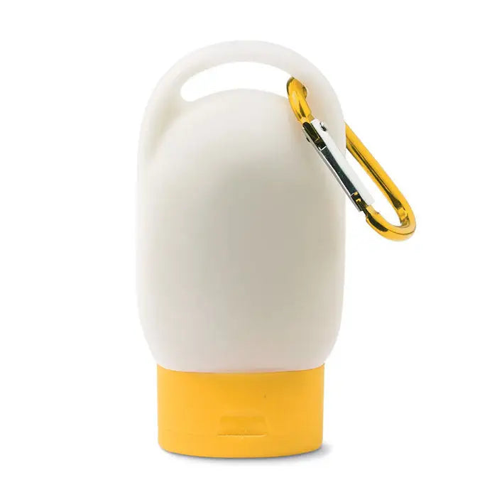 Recipienta de silicon alba si galbena de 30 ml cu clema aurie pentru lotiune de protectie solara de calatorie