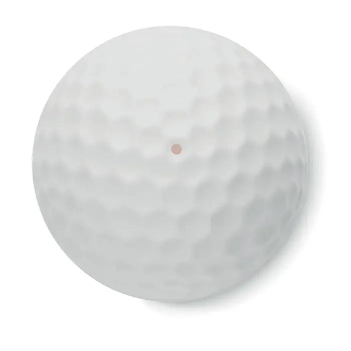 Balsam de buze în formă de minge de golf albă cu suprafață găurită și punct maro în centru