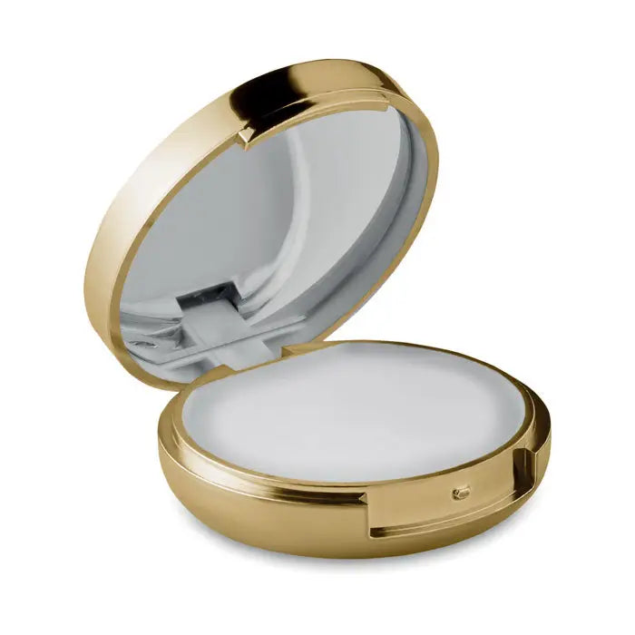 Balsam de buze în oglindă compactă aurie cu design rotunjit și interior oglindă pentru aplicare rapidă