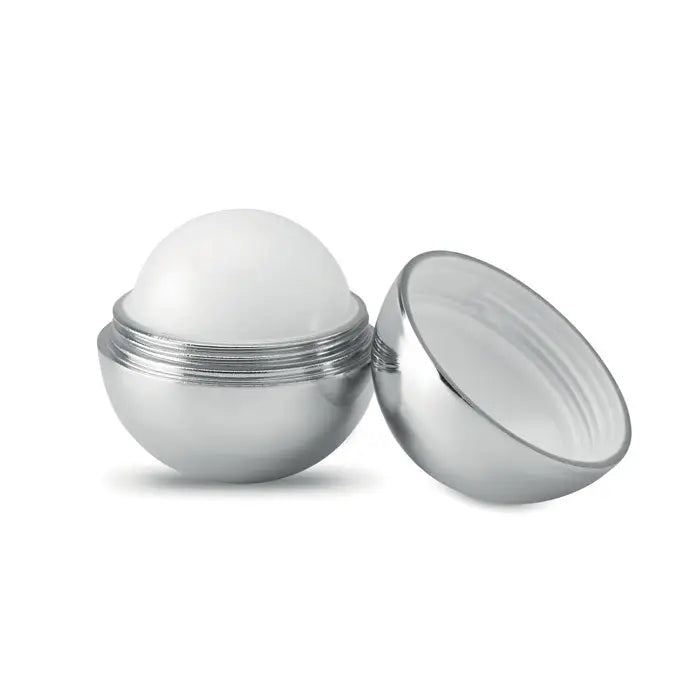 Balsam de buze rotund finisaj uv cu recipient sferic argintiu si bila alba cu textura fina