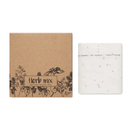 Cutie de carton kraft maro etichetata herba mix cu ilustratii botanice negre si pachet alb cu seminte mici pentru banda de seminte de ierburi de 3 metri