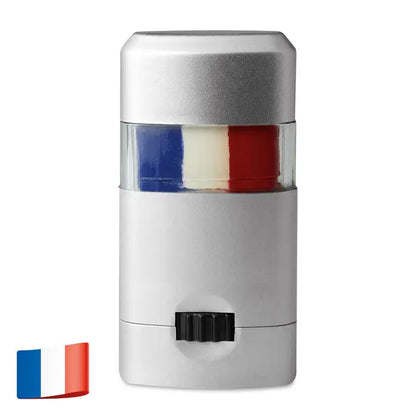 Baton de vopsea pentru corp argintiu cu sectiune transparenta ce arata segmente alb albastru si rosu asemanatoare steagului francez