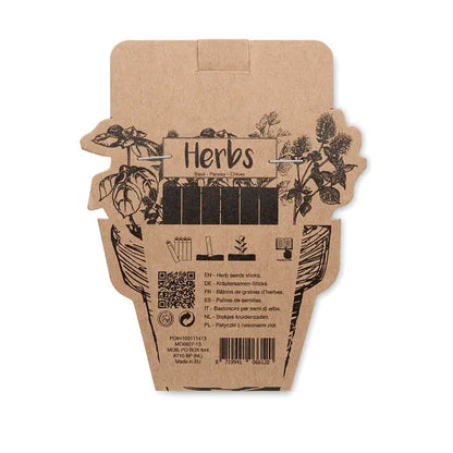 Pachet maro din carton in forma de ghiveci cu ilustratii negre de ierburi si betisoare de seminte de ierburi