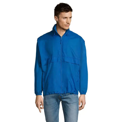 Blazer de vant unisex surf într-o nuanță vibrantă de albastru regal, jachetă ușoară din nylon cu fermoar integral și manșete elastice