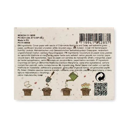 Bloc de note din hartie cu iarba cu autocolant alb din hartie reciclata ilustrand procesul de crestere al florilor