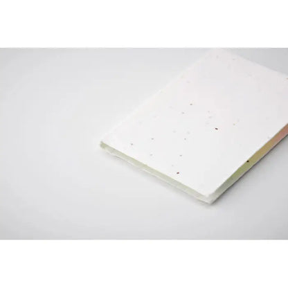 Bloc de note lipicioase din hartie cu seminte alb cu textura moale si pete usoare pentru notite ecologice
