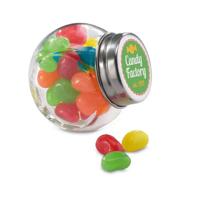 Borcan de sticla transparent cu capac argintiu si eticheta verde candy factory est ideal pentru jeleu