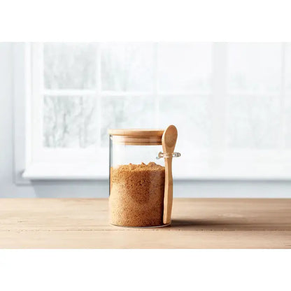 Borcan de sticla transparent cu capac din bambus si lingura din lemn, umplut cu zahar brun, 600 ml