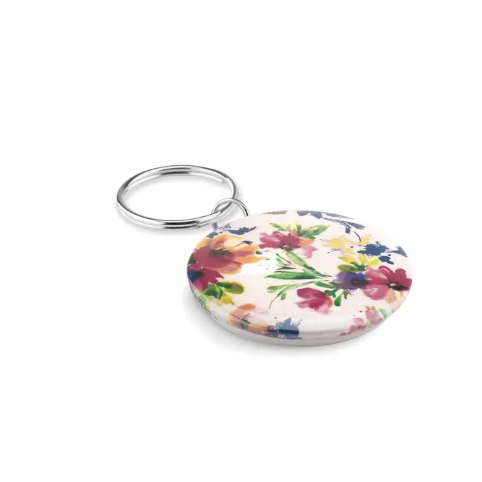 Breloc mic cu buton rotund alb cu model floral viu in nuante de roz rosu galben si verde