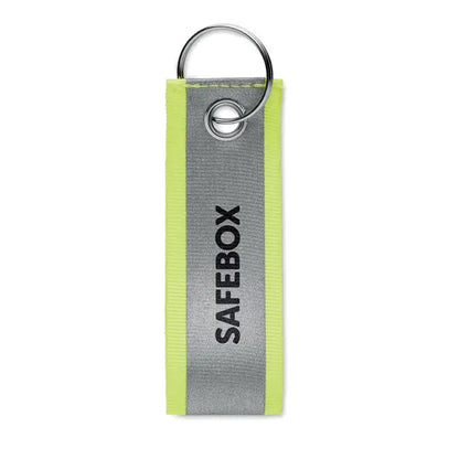 Breloc reflectorizant neon galben si argintiu cu text safebox negru pentru siguranta si vizibilitate sporita