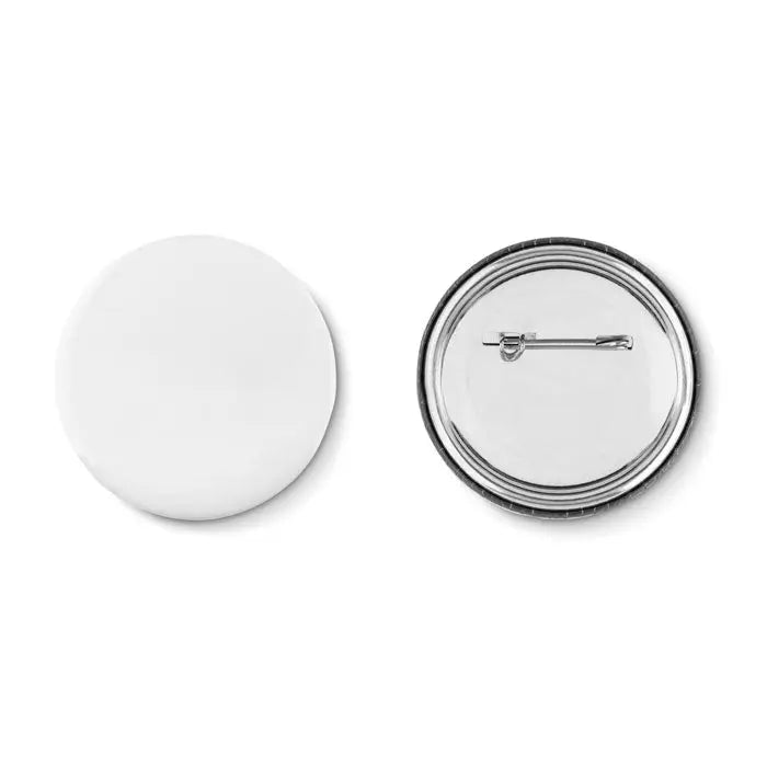 Butonul Fixati arată spatele unui buton circular alb cu ace metalic pentru fixare