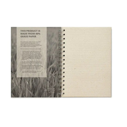Notebook a5 beige with textured grass paper cover and eco-friendly production details open on lined page
