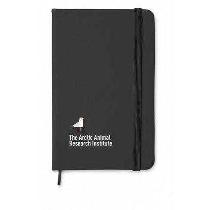 Notebook negru a6 cu 96 coli randuite si logo alb cu text the arctic animal research institute pe coperta