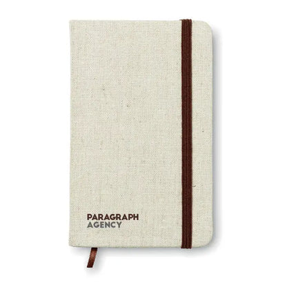 Notebook a6 beige din panza cu banda elastica maro si text paragraph agency imprimat pe coperta