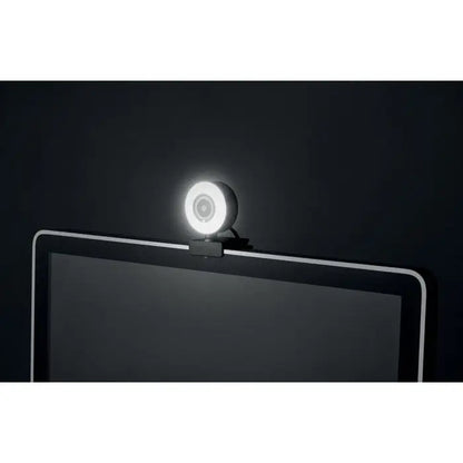 Webcam alb circular hd 1080p cu inel luminos montat pe marginea de sus a monitorului cu design minimalist