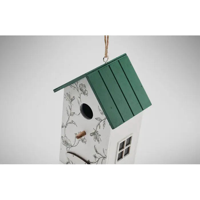 Casa pentru pasari din placaj alba cu acoperis verde si modele florale negre delicate cu gaura circulara mica