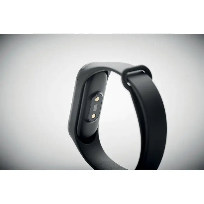 Ceas de sanatate fara fir inteligent negru din silicon cu design minimalist si senzori metalici, vedere din spate