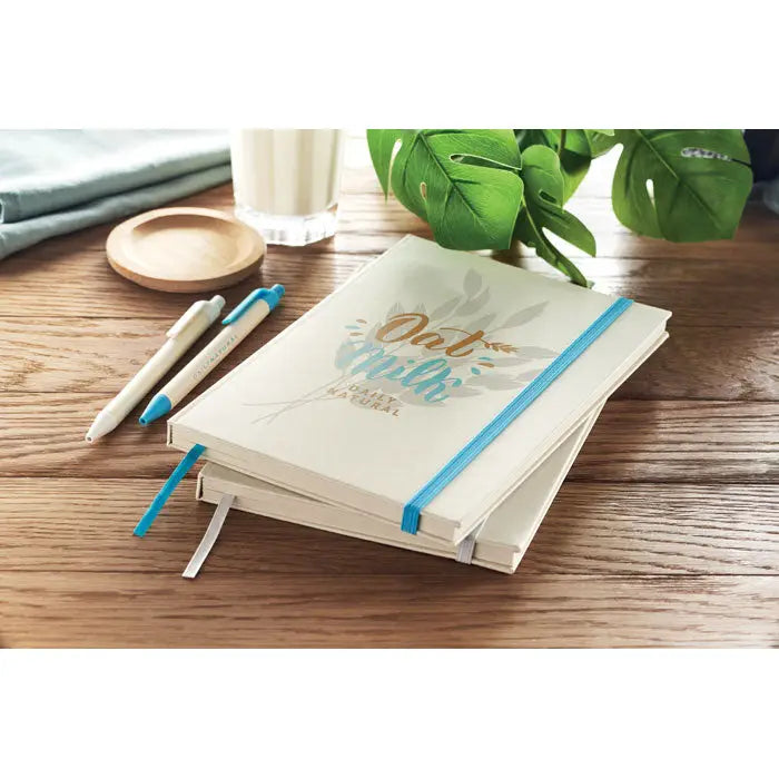 Crema caiet hardcover a5 cu elastic albastru si design aurit si verde teal lapte de ovaz cutie de lapte
