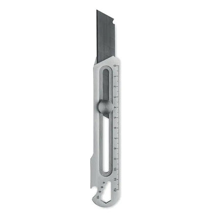 Cutit retractabil din metal argintiu cu lama retractabila si rigla integrata pentru taiere precisa