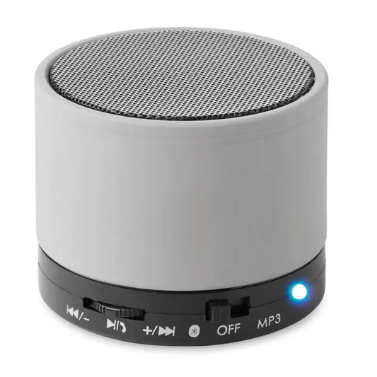 Difuzor rotund wireless gri cu grilaj de plasă și bază neagră cu butoane de control și indicator de lumină albastră