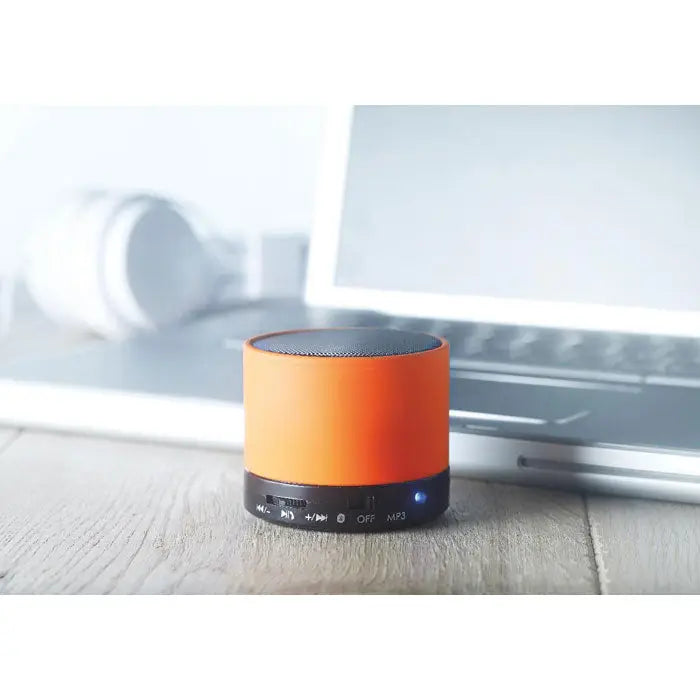 Difuzor rotund wireless portabil cilindric portocaliu cu baza neagra si butoane de control