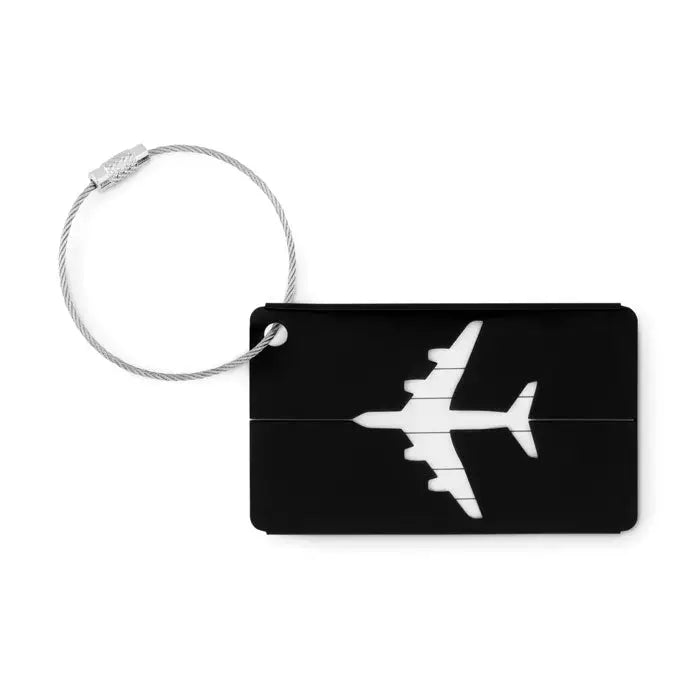 Eticheta de bagaje din aluminiu neagra cu silueta alba de avion si inchidere cu cablu argintiu