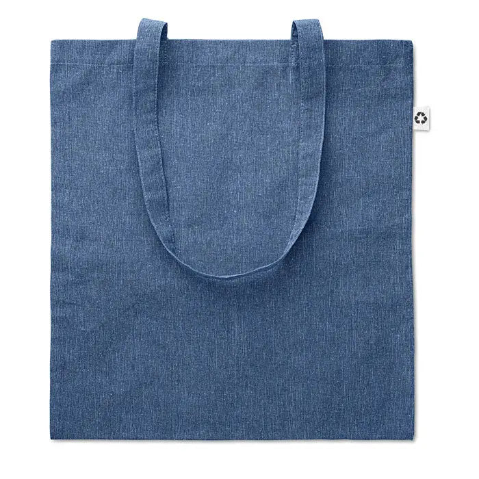Geanta de cumparaturi albastra din denim canvas cu manere asortate si eticheta alba mica pe partea laterala