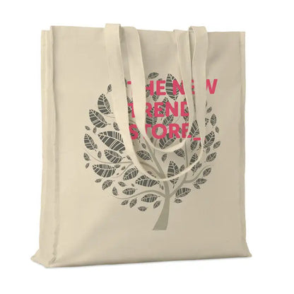 Geanta de cumparaturi din bumbac beige cu design copac frunze gri si text roz the new trend store