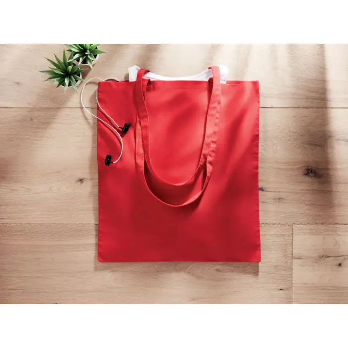 Geanta de cumparaturi rosie din bumbac 180 gr m² cu manere albe din material textil si inchidere cu snur