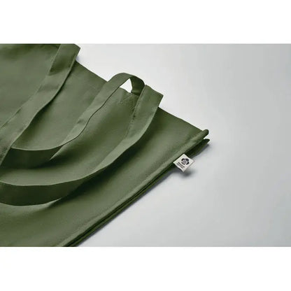 Geanta de cumparaturi din bumbac organic olive green cu manere rezistente si eticheta mica alba