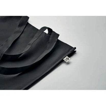 Geanta de cumparaturi din bumbac organic neagra cu manere rezistente si eticheta mica alba de brand