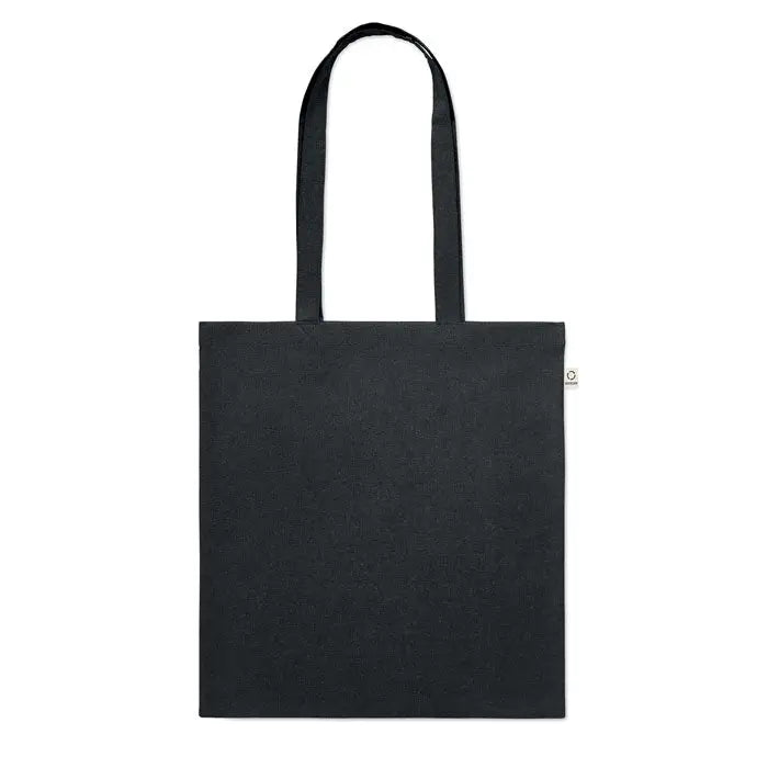 Geanta de cumparaturi din bumbac reciclat neagra cu manere rezistente si eticheta alba mica pe lateral