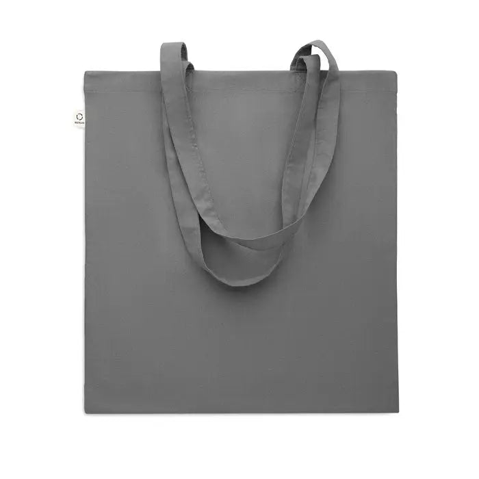 Geanta de cumparaturi din bumbac reciclat gri minimalist cu manere rezistente si eticheta alba mica pe lateral