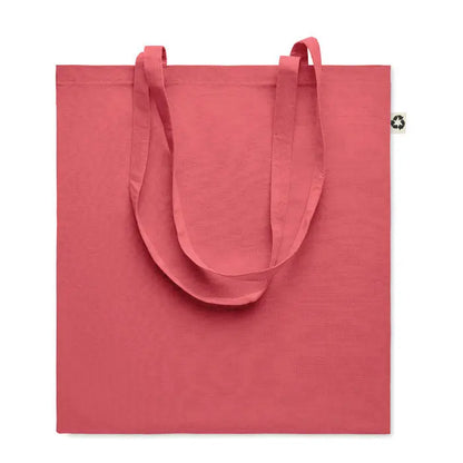 Geanta de cumparaturi din bumbac reciclat coral cu manere din material textil si eticheta mica pe colt