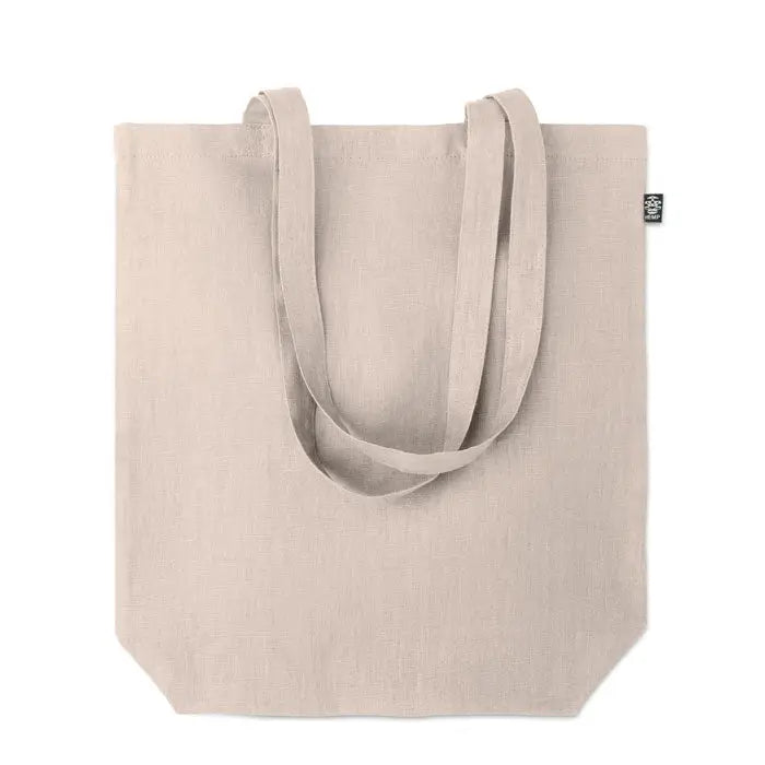 Geanta de cumparaturi din canepa 200 gr m² bej cu manere rezistente si eticheta neagra mica in colt