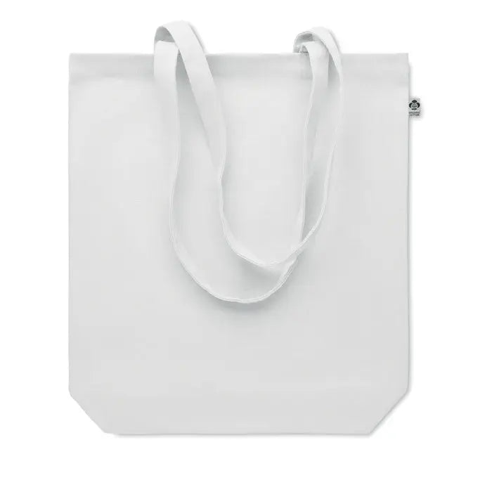 Geanta de cumparaturi din panza alba cu manere asortate si eticheta mica pe laterala fabricata din material 270 gr/m²