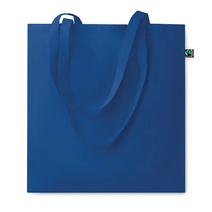 Geanta de cumparaturi fairtrade140gr/m² tote din panza albastru regal cu manere asortate si eticheta fairtrade mica