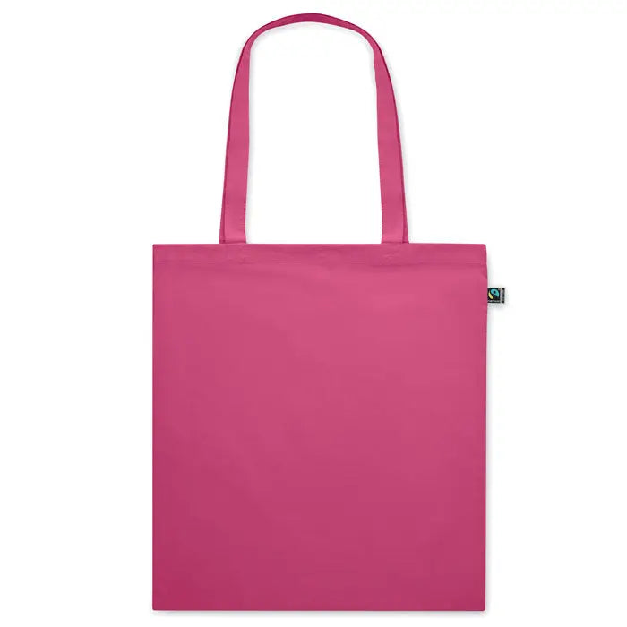 Geanta de cumparaturi fairtrade140gr/m² din panza fucsia vibranta cu manere asortate si eticheta verde small fair trade