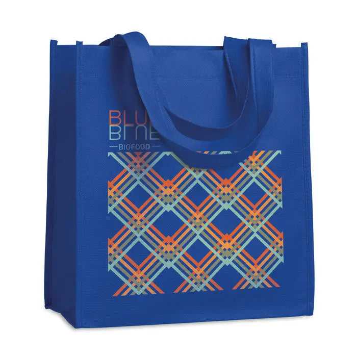 Geanta de cumparaturi netesuta albastra cu model geometric carouri portocaliu teal si gri la 80 gr/m²