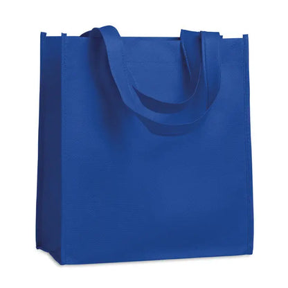 Geanta de cumparaturi netesuta de 80 gr/m² din material nețesut albastru regal cu manere rezistente