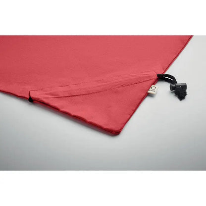 Geanta de cumparaturi pliabila din material 140 gr/m² rosie cu inchidere neagra si eticheta alba mica
