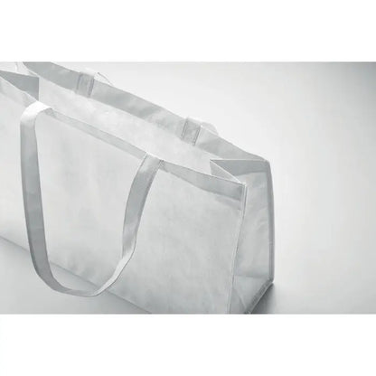 Geanta de cumparaturi rpet netesuta din plastic transparent cu manere albe intarite si design minimalist
