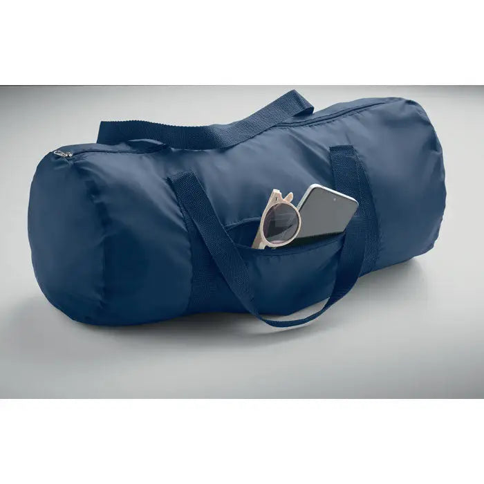 Geanta duffle 190t rpet 20l albastru navy din nylon cu bretele reglabile si buzunar frontal cu ochelari de soare si smartphone