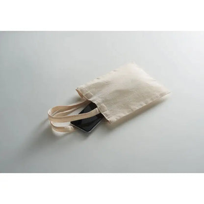 Geanta mica cadou din bumbac 140 gr/m² bej cu doua manere, deschisa partial, cu telefon negru inauntru